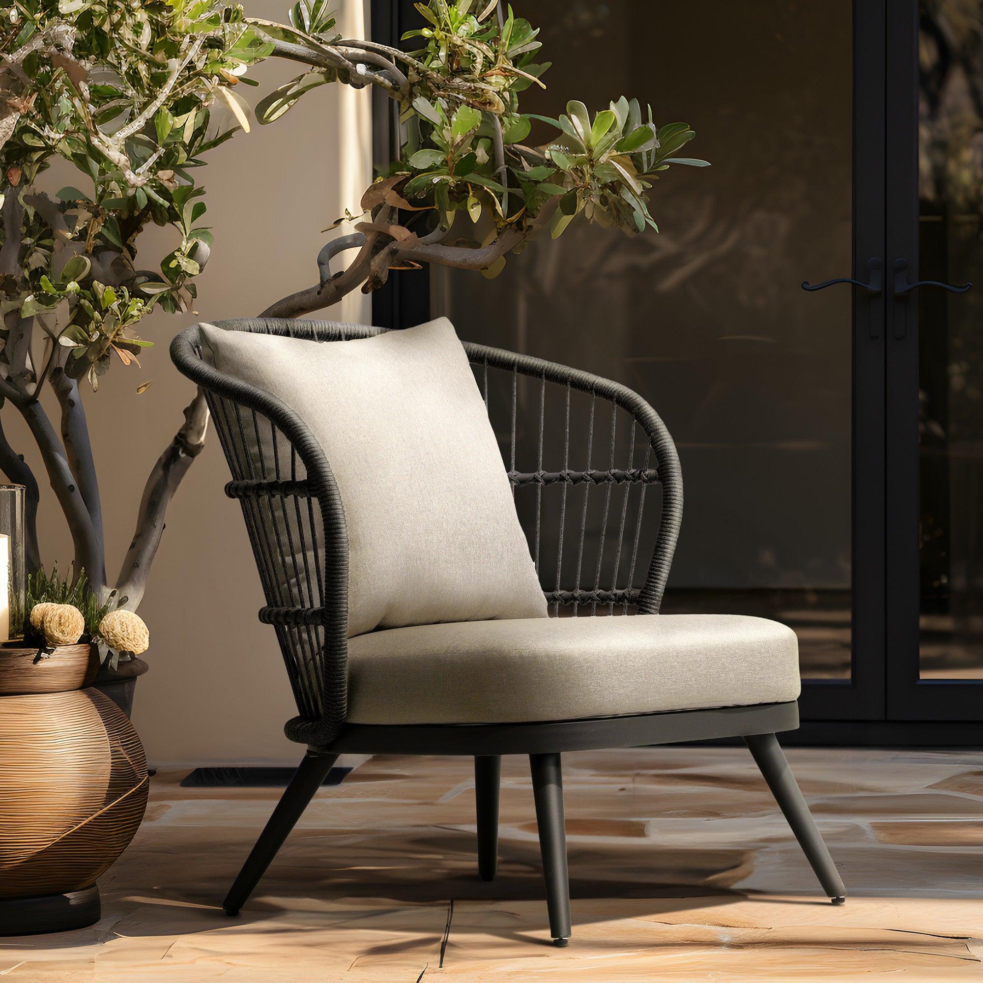 Comino Modern Rope Outdoor Furniture, dark grey aluminum frame lounge chair with backrest rope design and light grey cushions, in the garden- Sunsitt Furniture