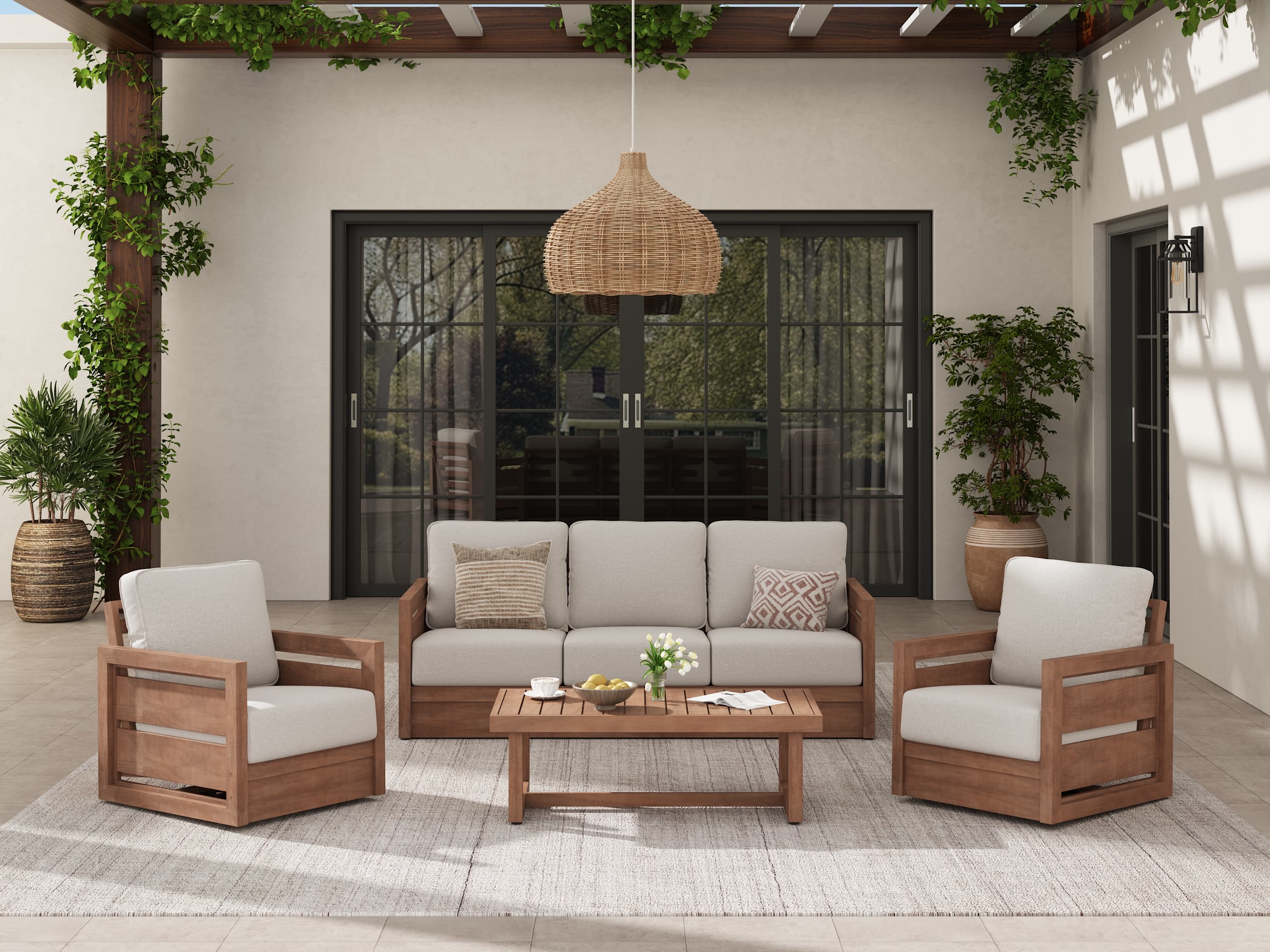 Outdoor patio set with wooden swivel chairs, sofa, and table in a sunlit room