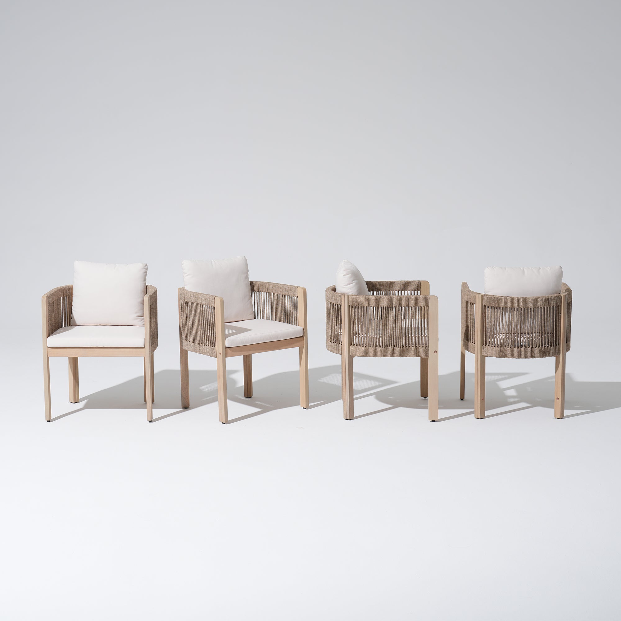 Four wooden chairs with woven rope armrests and white cushions, different angles- Sunsitt Modern Premium Outdoor Patio Furniture