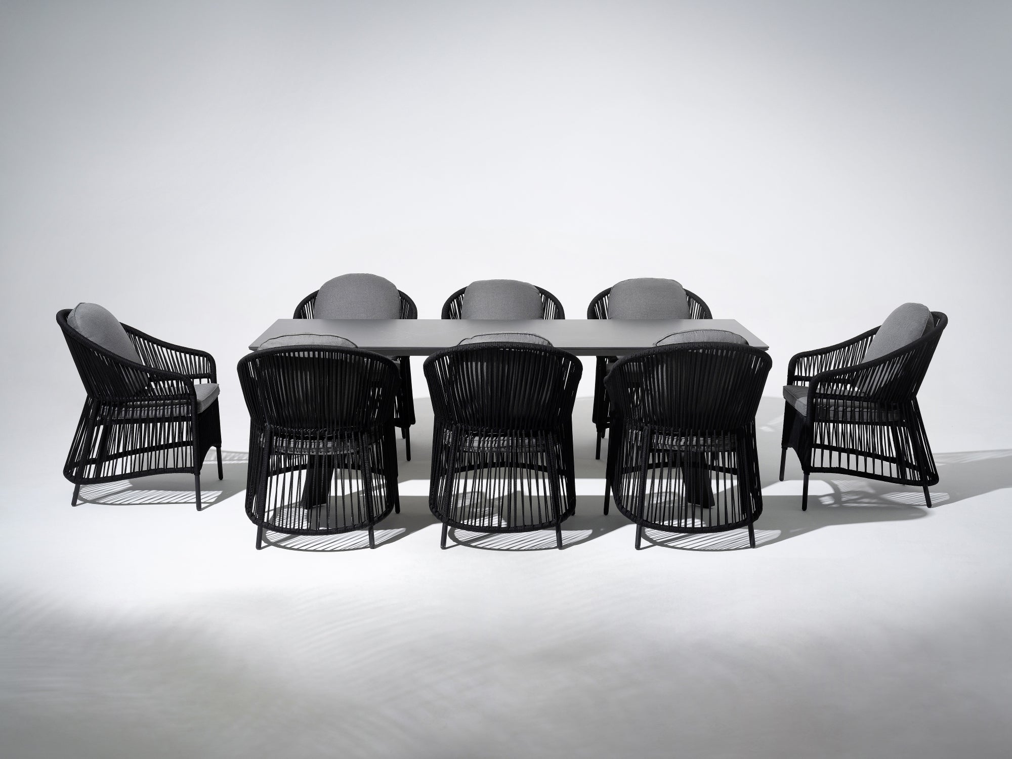 Aluminum Outdoor Dining Set For 8,  grey aluminum rectangular patio dining table and eight dining chairs with black rope design and gray cushions - Sunsitt Premium Modern Outdoor Patio Dining Furniture Set